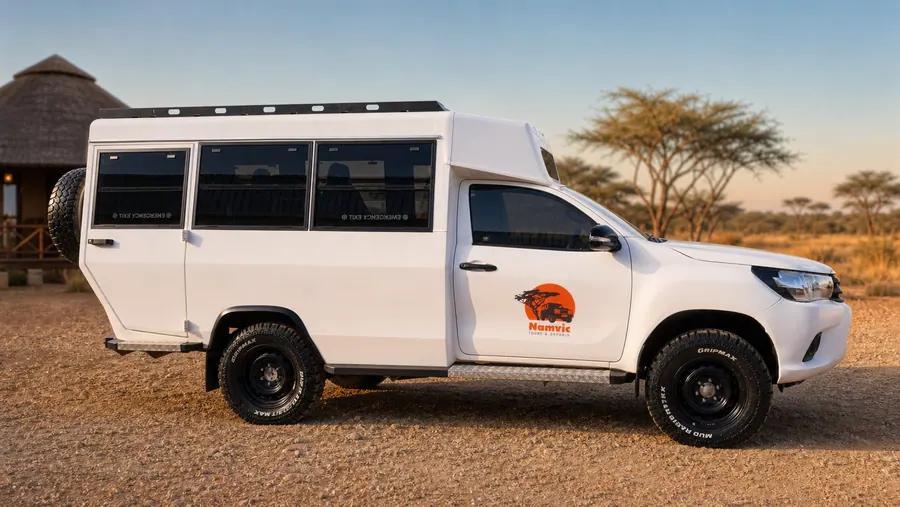 Hilux 10-seater safari vehicle - Namvic-led safari vehicle for guided groups, with driver or guide arranged separately.