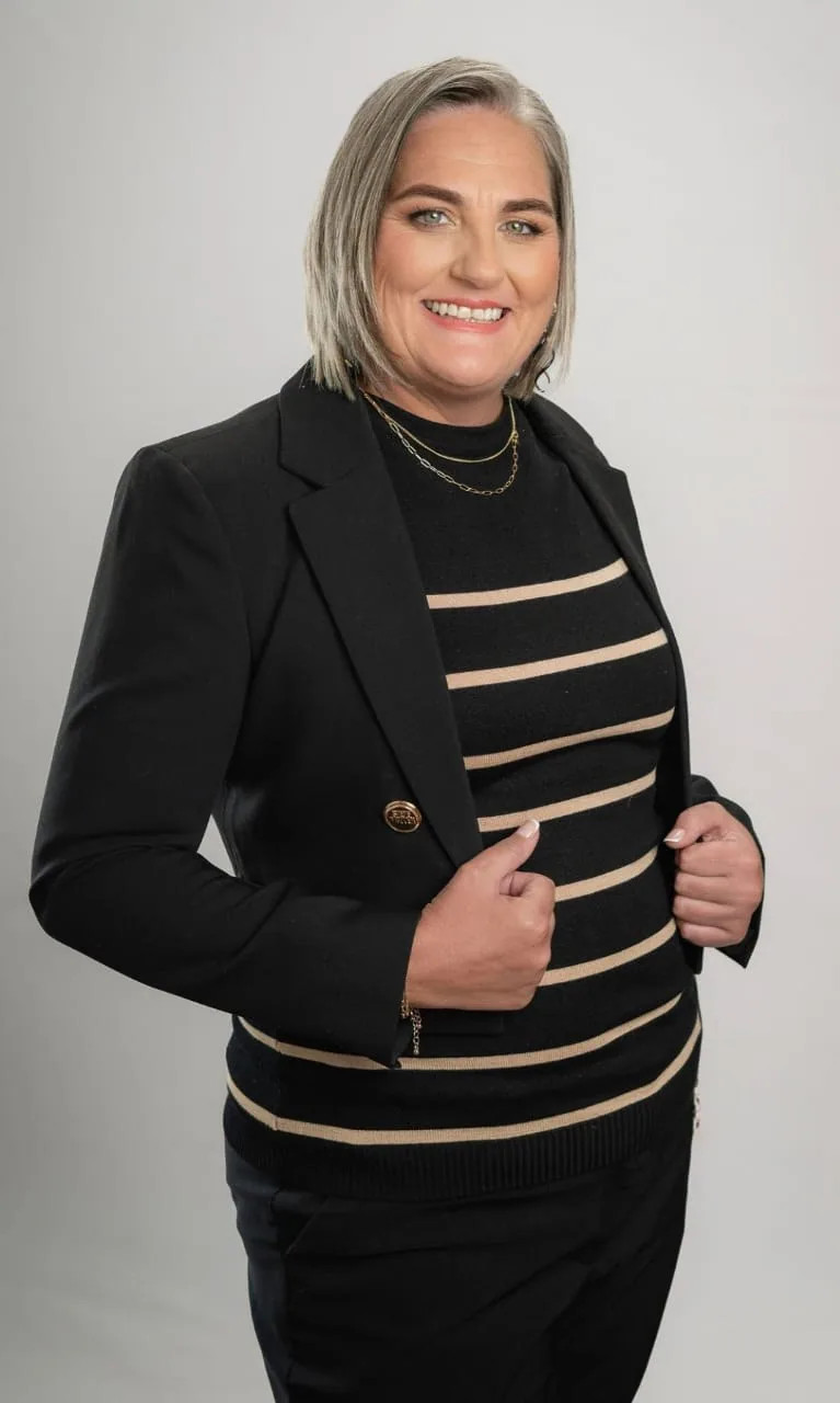 Lindy de Beer, Namvic Tours and Safaris bookkeeper, smiling in a professional portrait